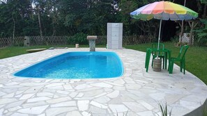 Outdoor pool, open 10:00 AM to 8:00 PM, pool umbrellas