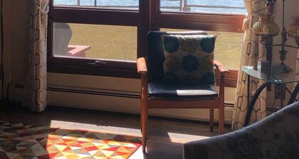 Fenced in yard! Lovely Mid Century Feel with all Bedrooms facing the Water!