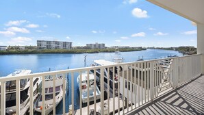 A balcony with a view of a marina and a river. - Waterfront, Harbourside, Water Park, Beach, #3318 (Indian Rocks Beach)