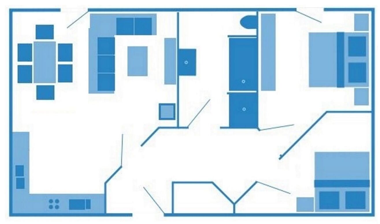 A floor plan with multiple rooms, a kitchen area, and a dining space.