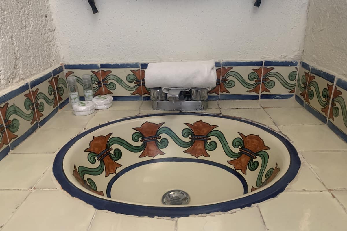 family room | bathroom | shower, rainfall showerhead, hair dryer, towels