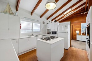 Enjoy cooking in this well-equipped kitchen with a gas stove and central island.