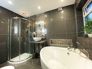 Bathtub, hair dryer, towels