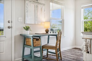 Work in comfort with a desk, chair, and natural views.