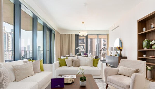 Signature Apartment, City View | Living area | TV