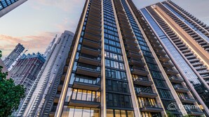 A high-rise building with multiple floors, large windows, and balconies. - Dream Inn Apartment- Boulevard Heights (Dubai)