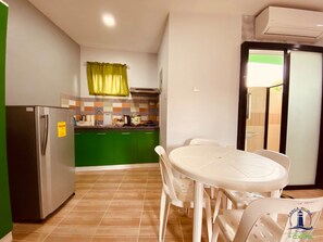 Family Room | Private kitchen - Cerca Parola Beach Resort by Cocotel (Lobo)