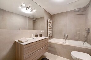 Bathtub, hair dryer, towels