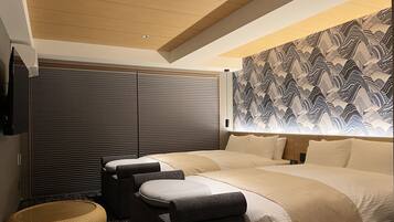 A modern hotel room with a large bed, a seating area with a woven basket, and a patterned wall.