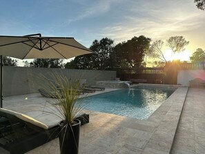 Seasonal outdoor pool, open 8:00 AM to 8:00 PM, pool umbrellas