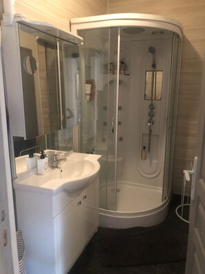 Shower, hair dryer, towels, soap