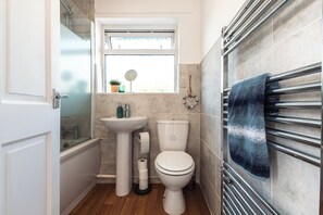 Combined shower/tub, hair dryer, towels, soap