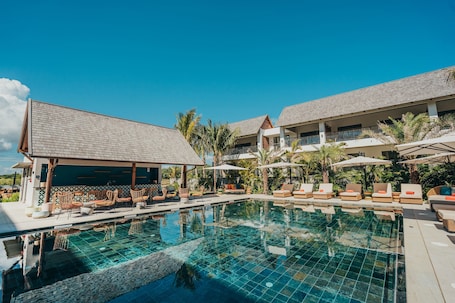 Indoor pool, outdoor pool, pool loungers. Domaine de Grand Baie