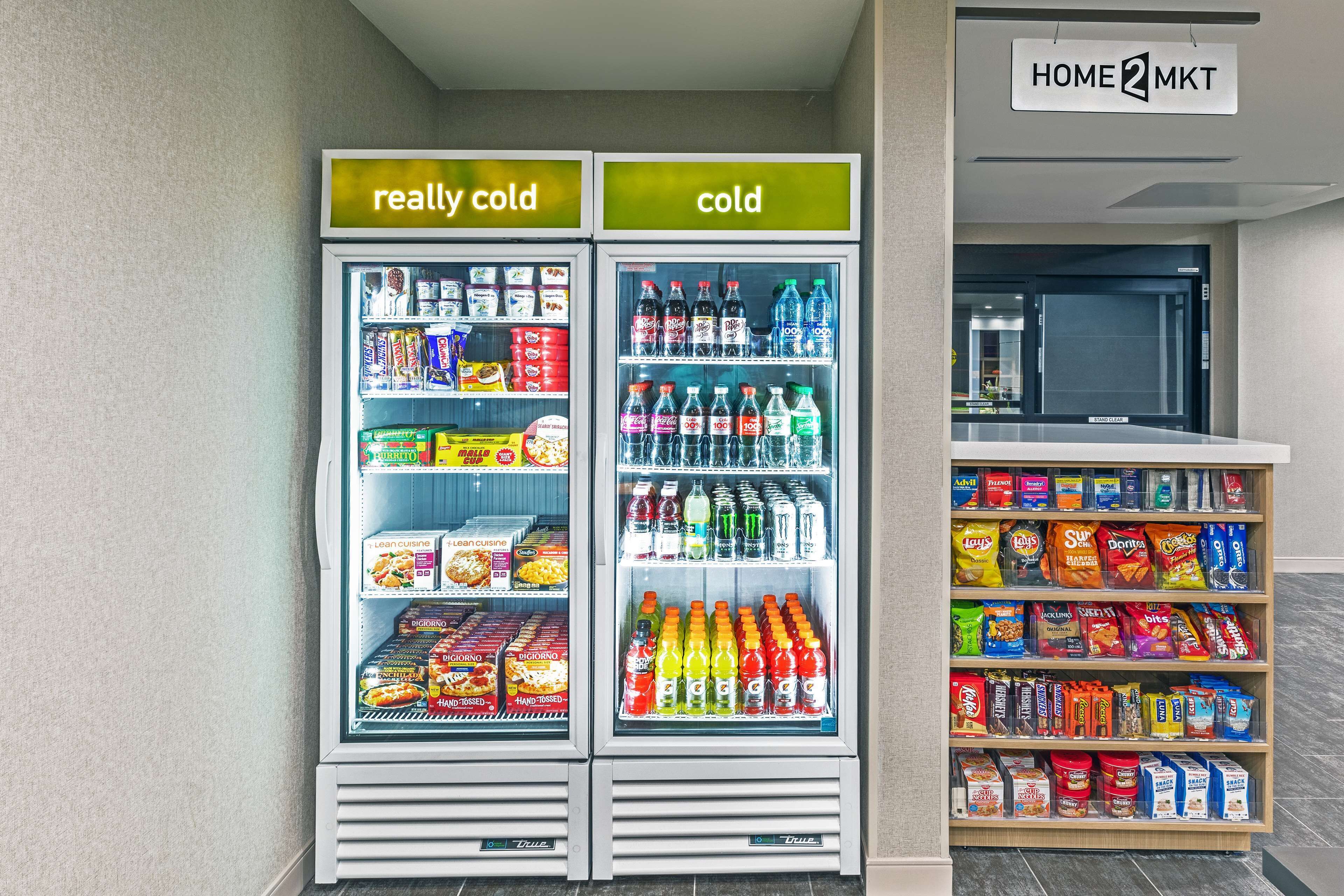 A vending machine with snacks and drinks, labeled "really cold" and "cold".