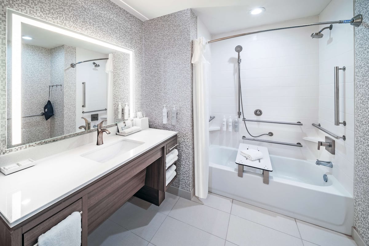 studio suite, 1 king bed, accessible, bathtub | bathroom | combined shower/bathtub, towels