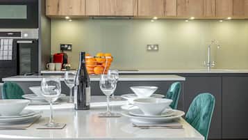 Deluxe Apartment, 2 Bedrooms | Living area | 50-inch Smart TV with digital channels, TV