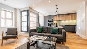 Deluxe Apartment, 2 Bedrooms | Living area | 50-inch Smart TV with digital channels, TV