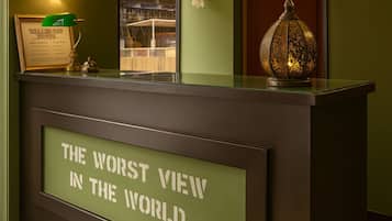 A reception desk with a sign reading "THE WORST VIEW IN THE WORLD".