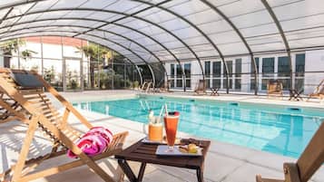 Indoor pool, seasonal outdoor pool, pool umbrellas, sun loungers