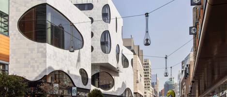 A modern building with large windows and a unique architectural design.