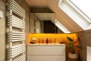 Bathtub, hair dryer, towels, soap