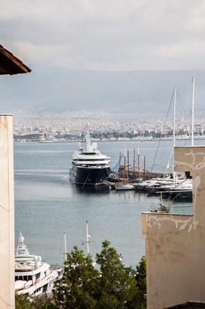 Moored yachts line the marina, offering stunning views of the cityscape.