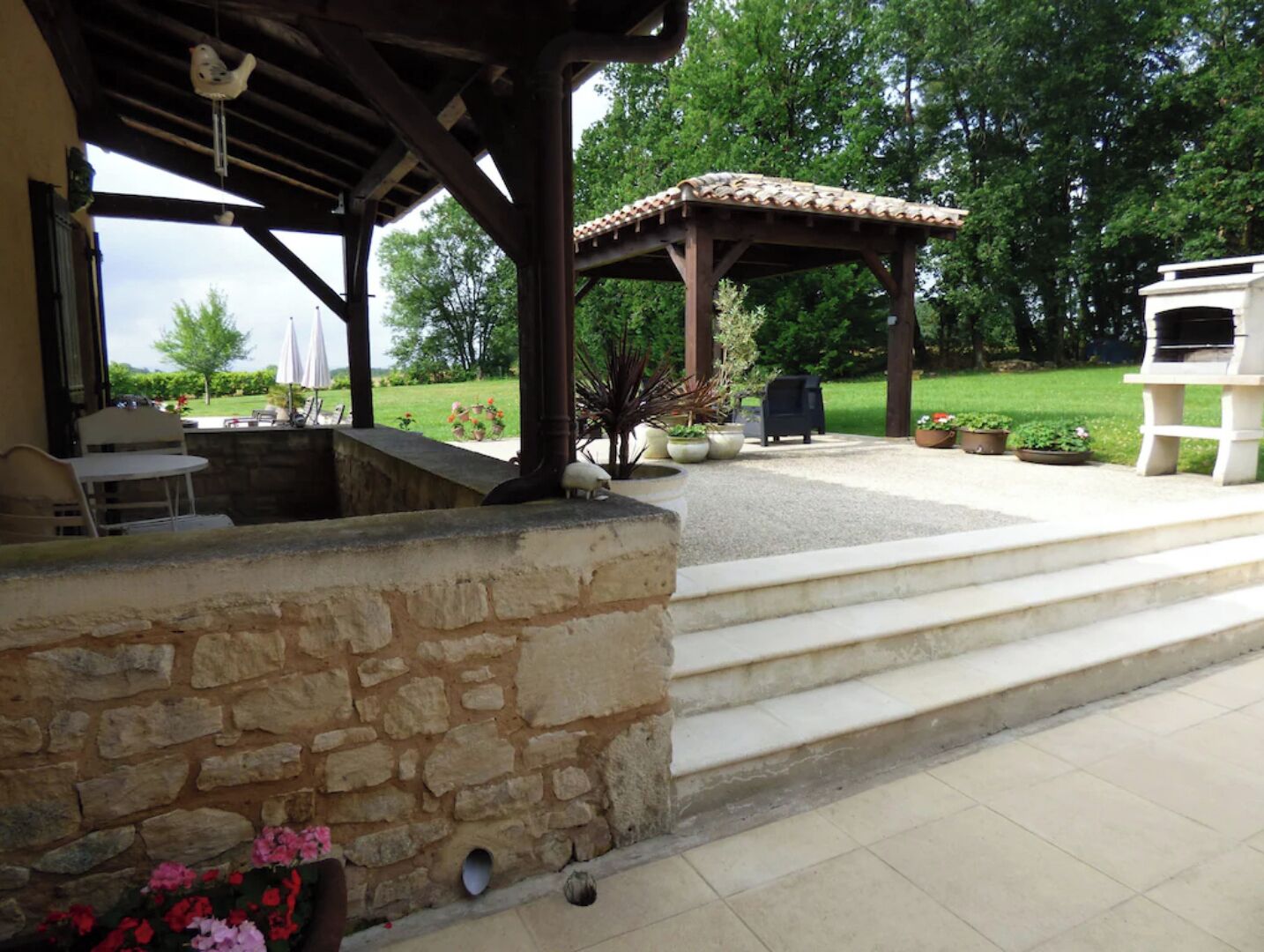 Patio area to the back of the house by the pool.