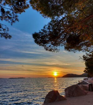 On the beach, sun-loungers