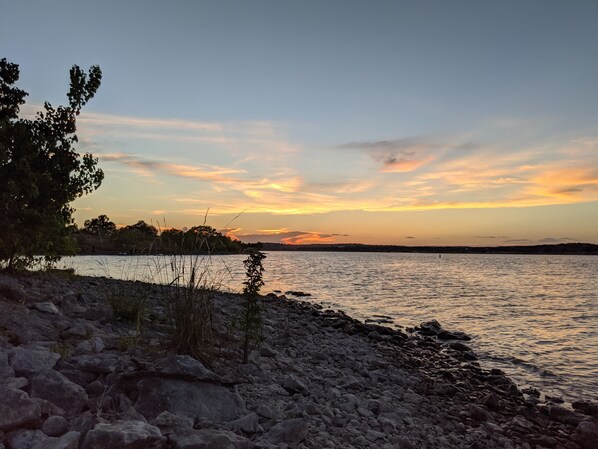 Surrounded by serene waters and lush vegetation, this lakeside retreat offers a tranquil atmosphere.