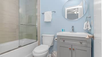 Combined shower/tub, hair dryer, towels, toilet paper