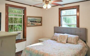 2 habitaciones y tabla de planchar con plancha