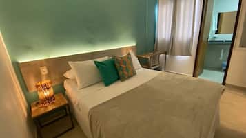 Double Room Side City View | Desk, laptop workspace, bed sheets