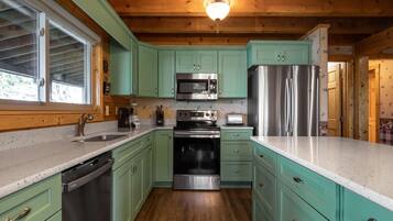 Cabin, Multiple Beds, Patio | Private kitchen | Fridge, microwave, oven, stovetop