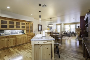 Kitchen area with central island, dining space, and cozy living area.