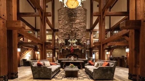 Relax by the fireplace in our spacious lobby, surrounded by artwork and a grand staircase.