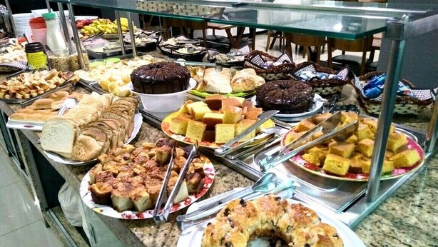 A buffet with various baked goods and desserts. - Hotel Sao Luiz (Aparecida)