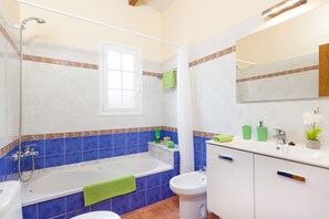 Bathtub, hair dryer, towels