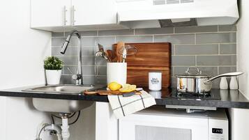 Premium Room, 1 Queen Bed, Accessible | Private kitchen | Dining tables