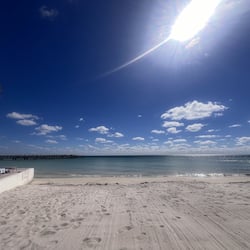 On the beach, sun-loungers, beach towels
