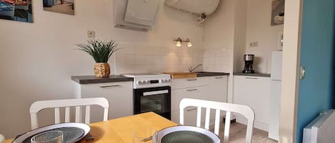 Fridge, microwave, toaster, cookware/dishes/utensils