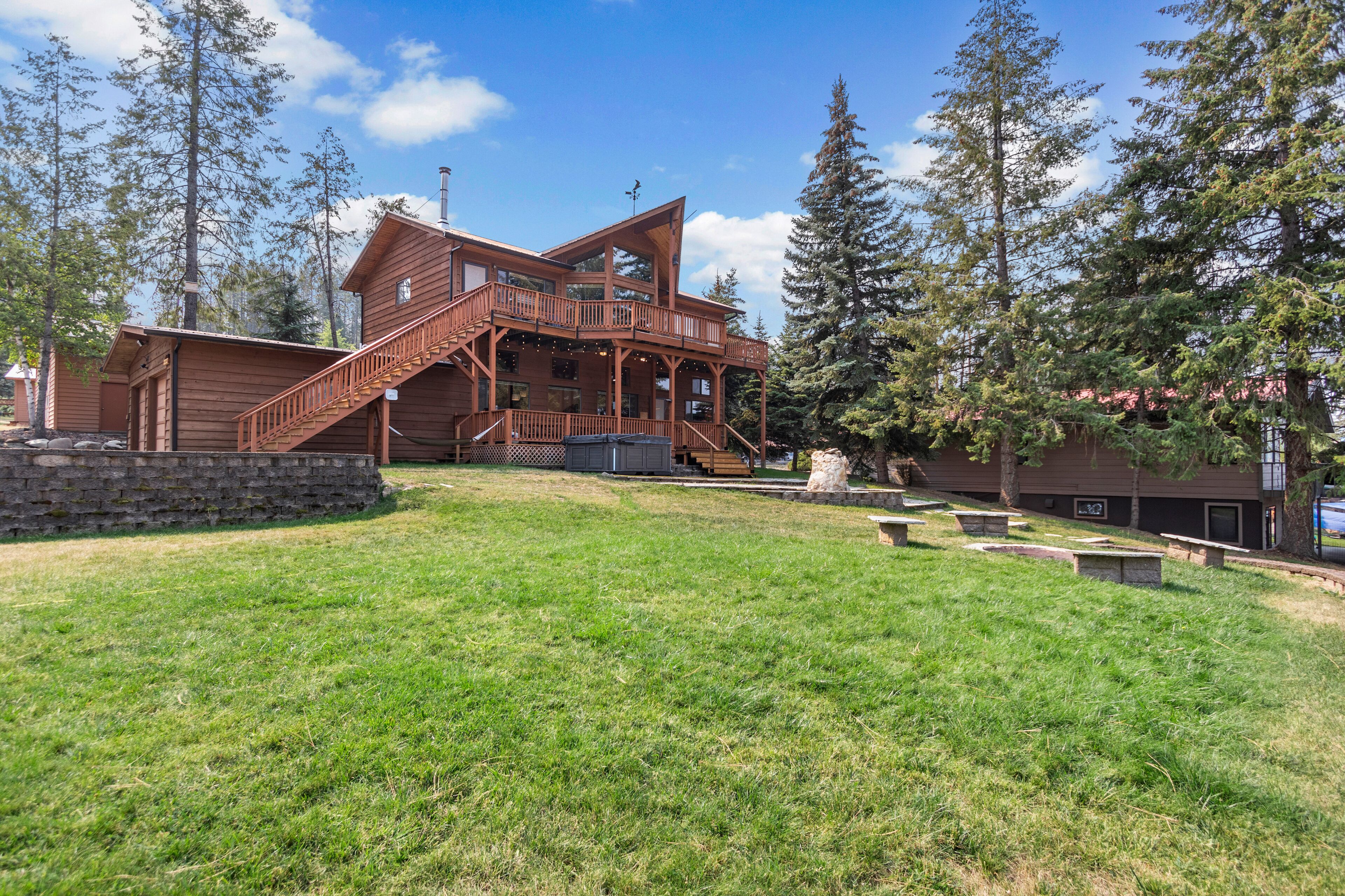 Spacious lakefront home with private hot tub, dock, boat lift, views & game room