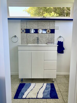 Shower, towels, soap, toilet paper