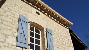 A stone building with a window and shutters. - House for 8 people with swimming pool, south west of france (Montcuq-en-Quercy-Blanc)