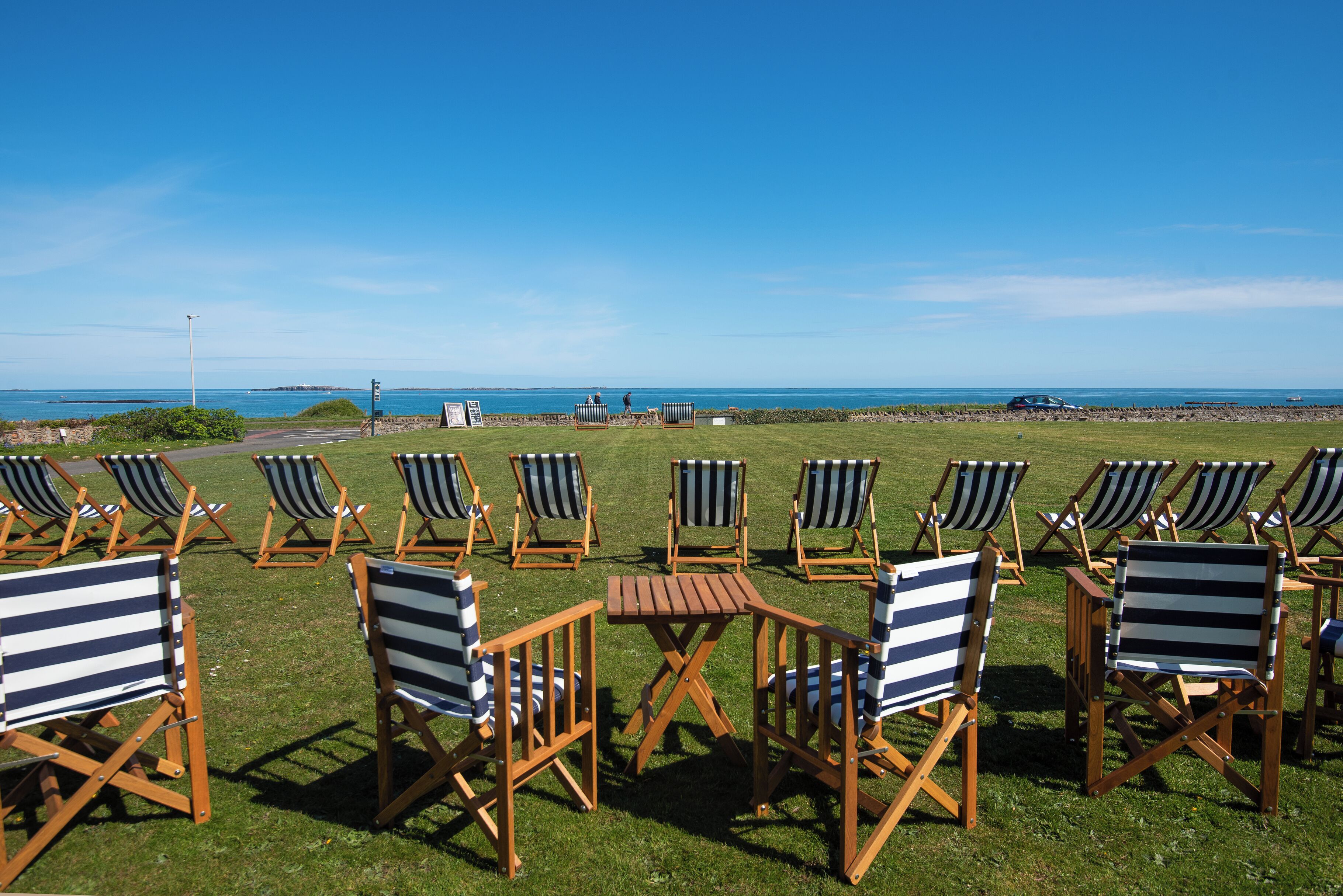 Outdoor seating with a view of the ocean.