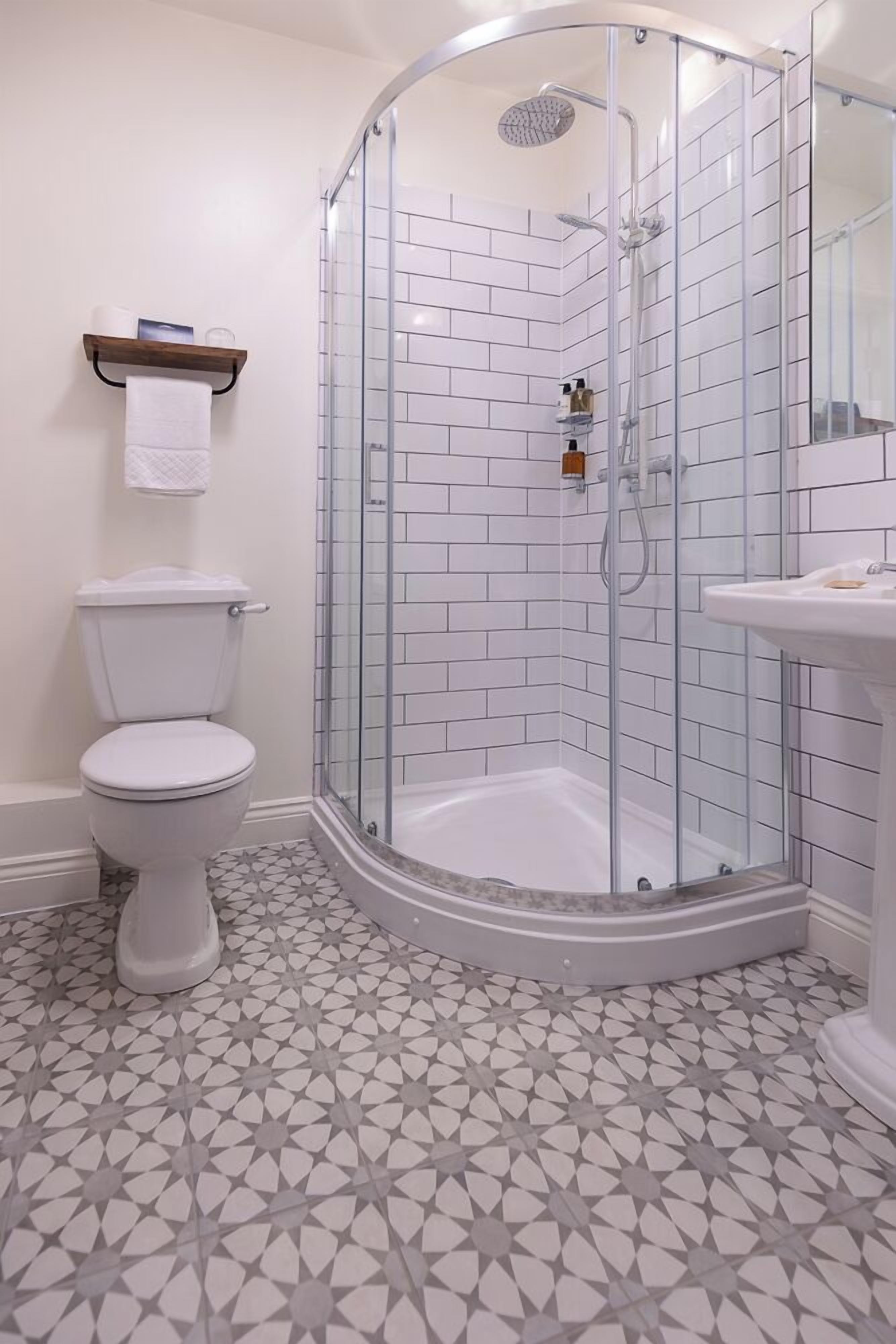 single skylight room - not pet friendly | bathroom | designer toiletries, hair dryer, towels, soap