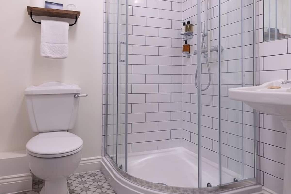 single skylight room - not pet friendly | bathroom | designer toiletries, hair dryer, towels, soap