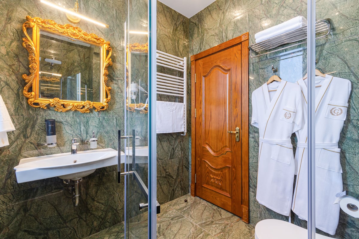 Designer toiletries, hair dryer, bathrobes, slippers