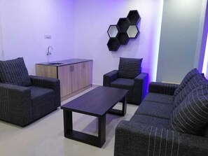 Luxury Suite, 1 Bedroom, Non Smoking, Private Bathroom | Living area | 32-inch LCD TV with cable channels, TV -  Leisure Inn Resort by NHospitality (Cheyyur)