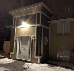 Stunning two-story building with a double entrance and central garage area.