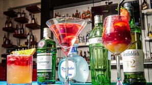 A bar with various bottles and glasses of drinks. - PORI CITY HOTEL (Nairobi)